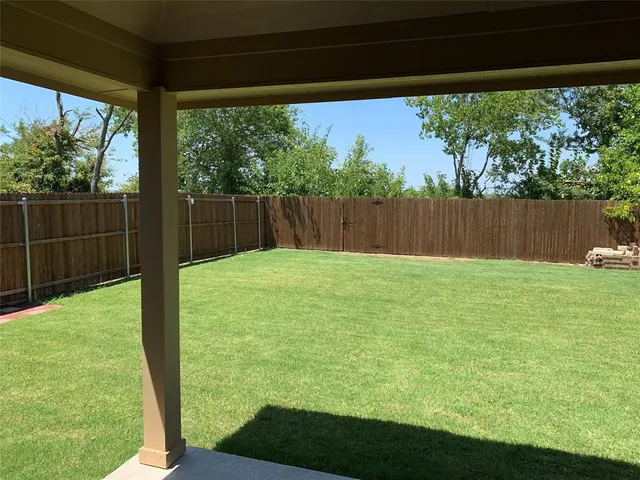 a view of backyard with green space