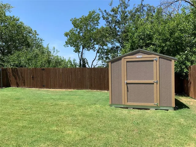 a backyard of a house with lots of green space
