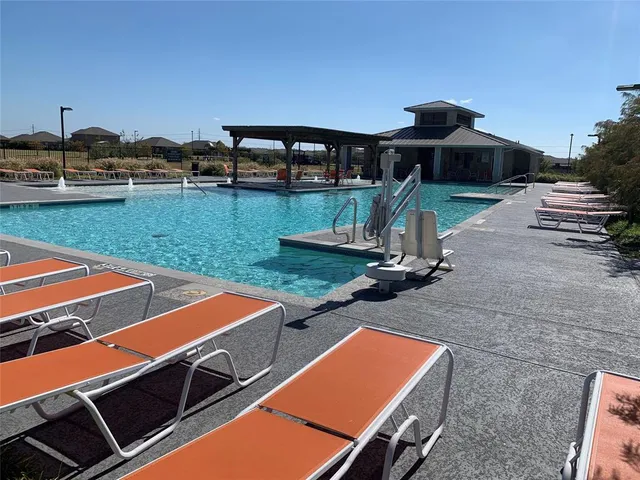 a view of a swimming pool with an outdoor space
