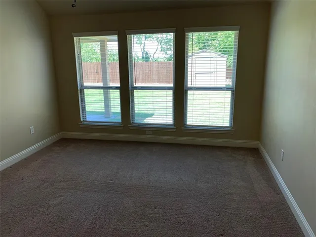 a view of a room that has a window in it