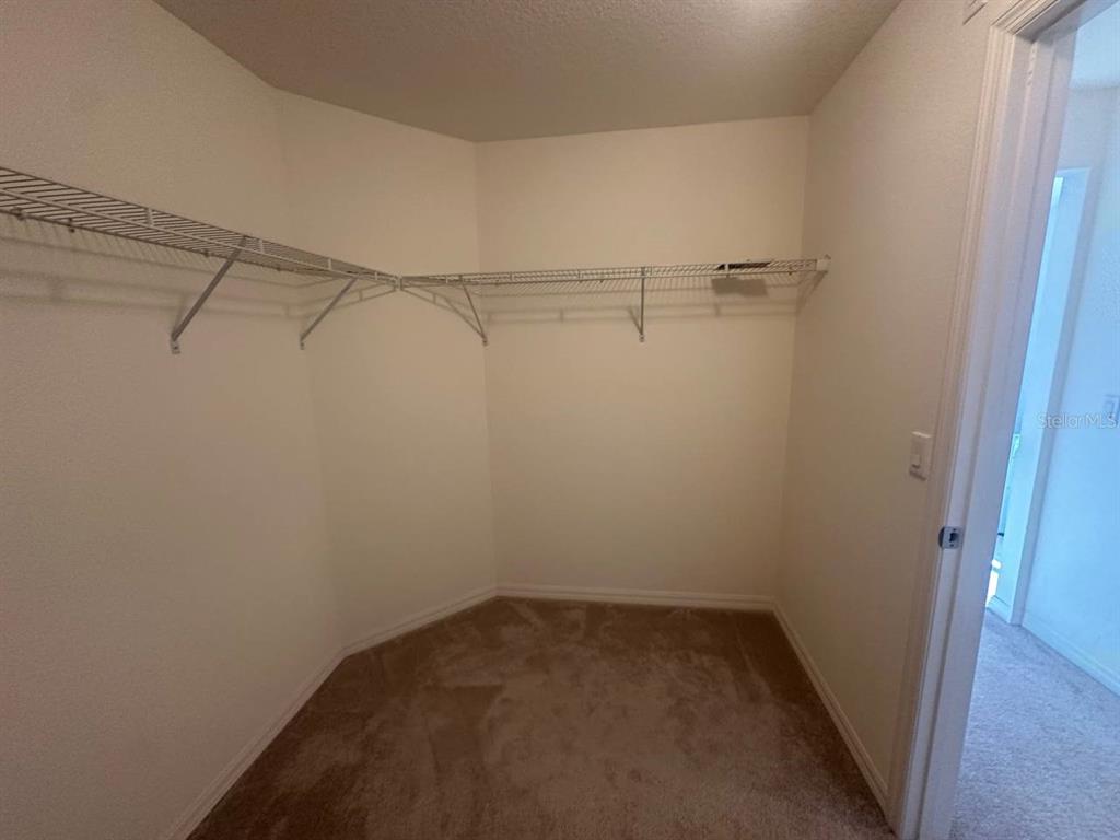 3877 Mount Vernon Way Kissimmee, FL 34741 - Photo 17 of 27 a view of a room with racks on the wall