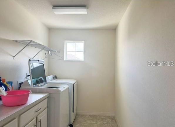 3877 Mount Vernon Way Kissimmee, FL 34741 - Photo 20 of 27 a storage room with washer and dryer