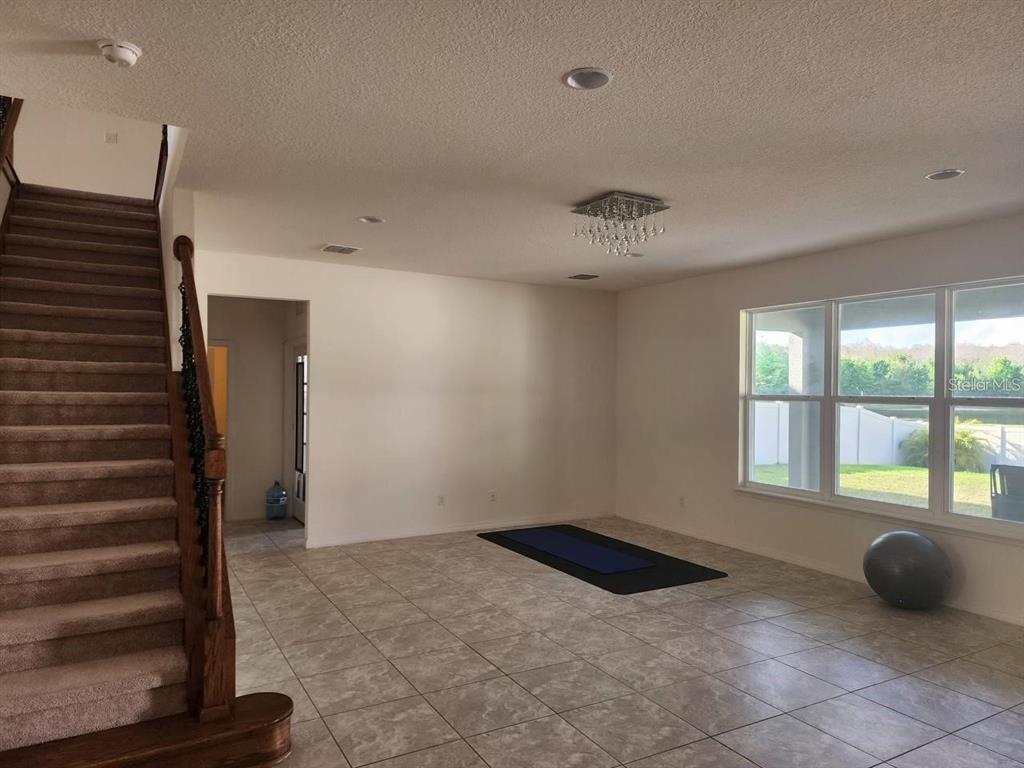 3877 Mount Vernon Way Kissimmee, FL 34741 - Photo 6 of 27 a view of an empty room with a window