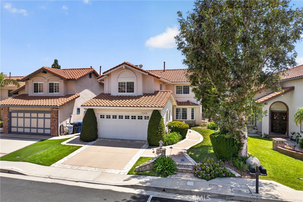 19468 Kilfinan Street Porter Ranch, CA 91326 - Photo 1 of 1 a front view of a house with garden
