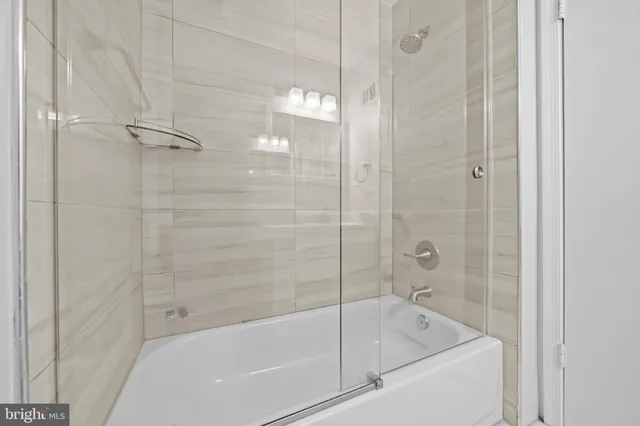 a view of backyard with a garden and deck