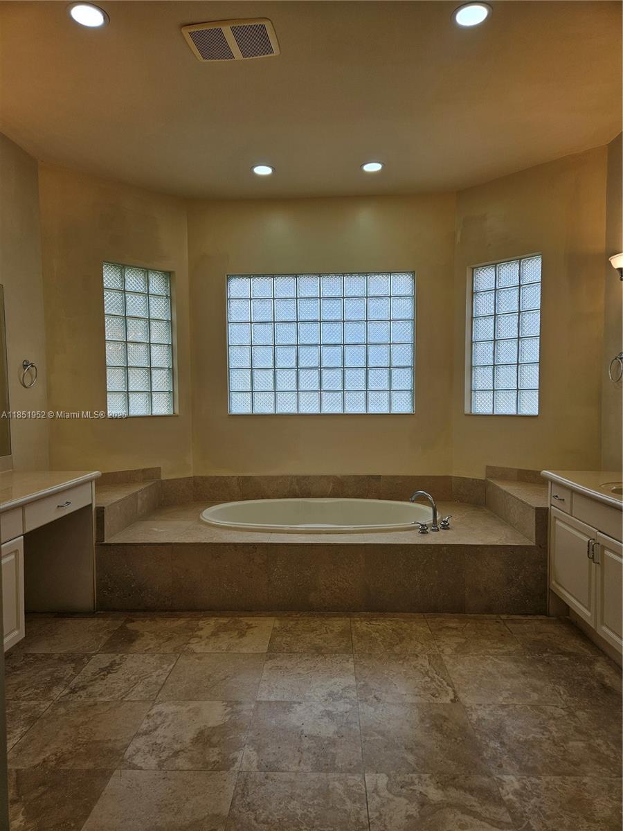 18951 Southwest 30th Street Miramar, FL 33029 - Photo 13 of 62 a bathroom with a bathtub and sink