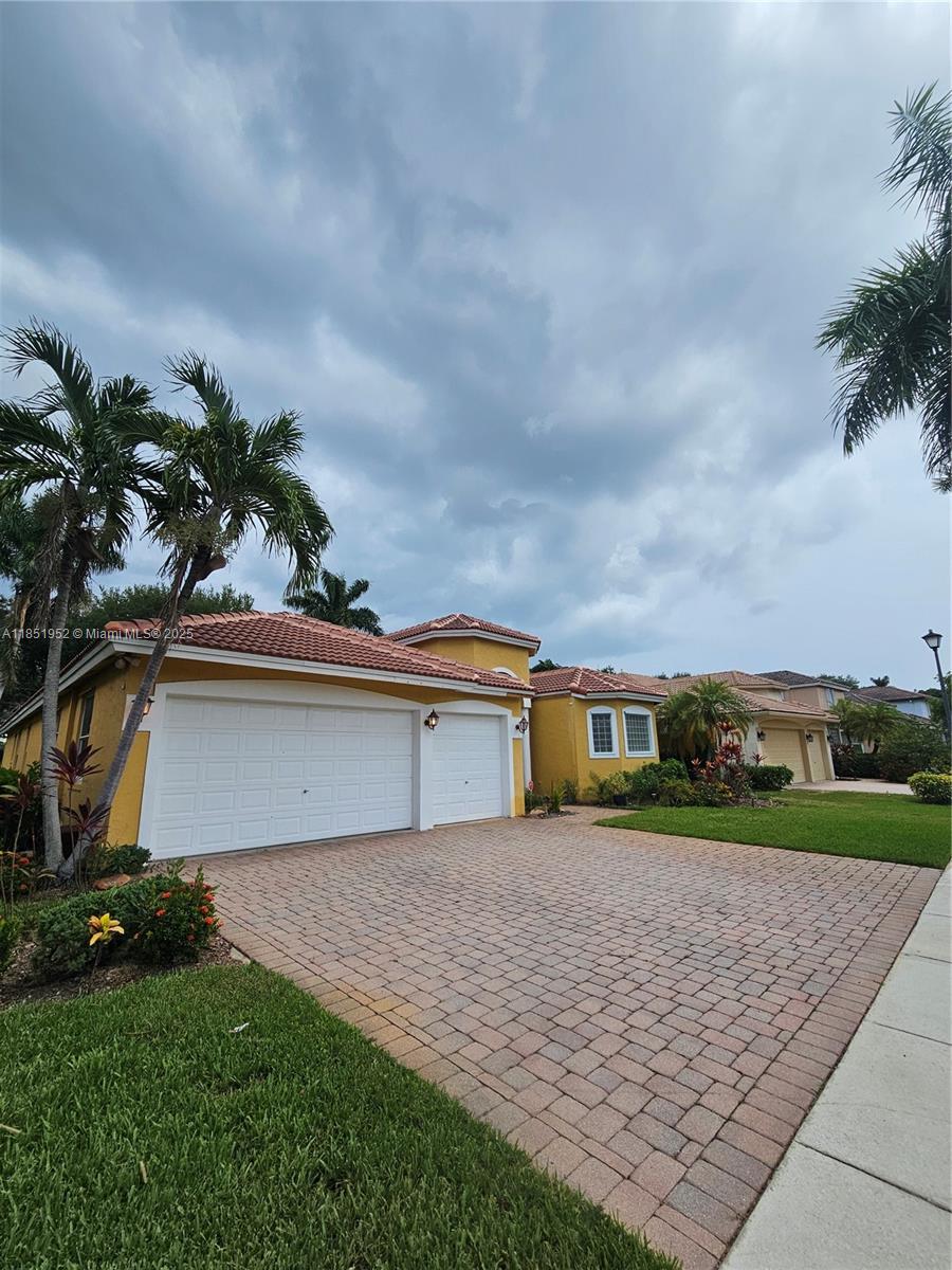 18951 Southwest 30th Street Miramar, FL 33029 - Photo 2 of 62 a view of house with outdoor space and car parked