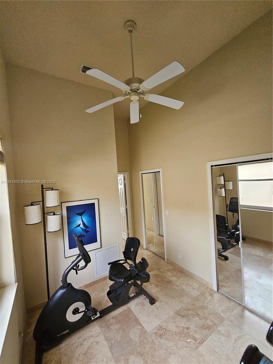 18951 Southwest 30th Street Miramar, FL 33029 - Photo 21 of 62 a room with furniture and gym equipment
