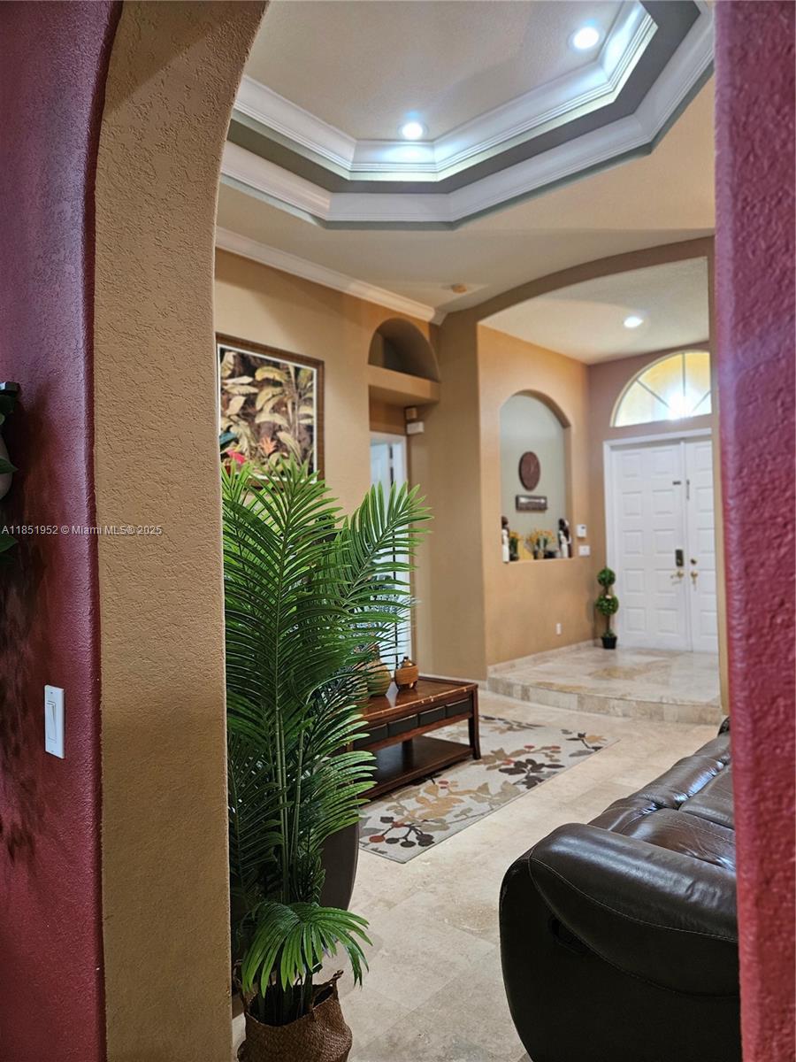 18951 Southwest 30th Street Miramar, FL 33029 - Photo 25 of 62 a living room with furniture and a potted plant