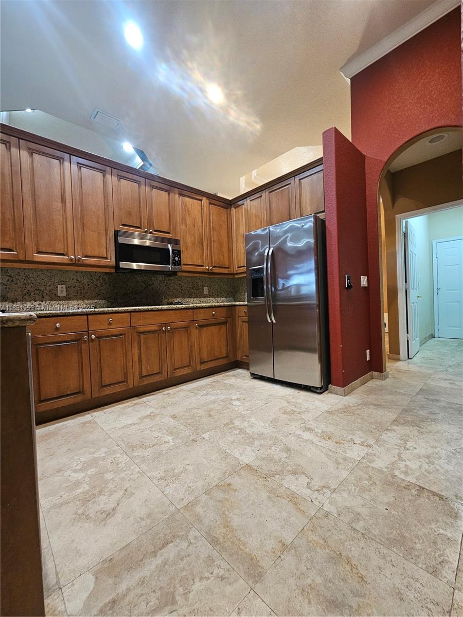 18951 Southwest 30th Street Miramar, FL 33029 - Photo 29 of 62 a large kitchen with cabinets and stainless steel appliances