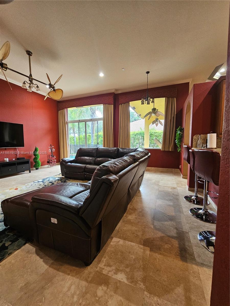 18951 Southwest 30th Street Miramar, FL 33029 - Photo 32 of 62 a living room with furniture fireplace and large windows