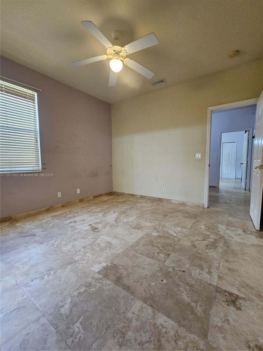 18951 Southwest 30th Street Miramar, FL 33029 - Photo 39 of 62 an empty room with a fan & a window