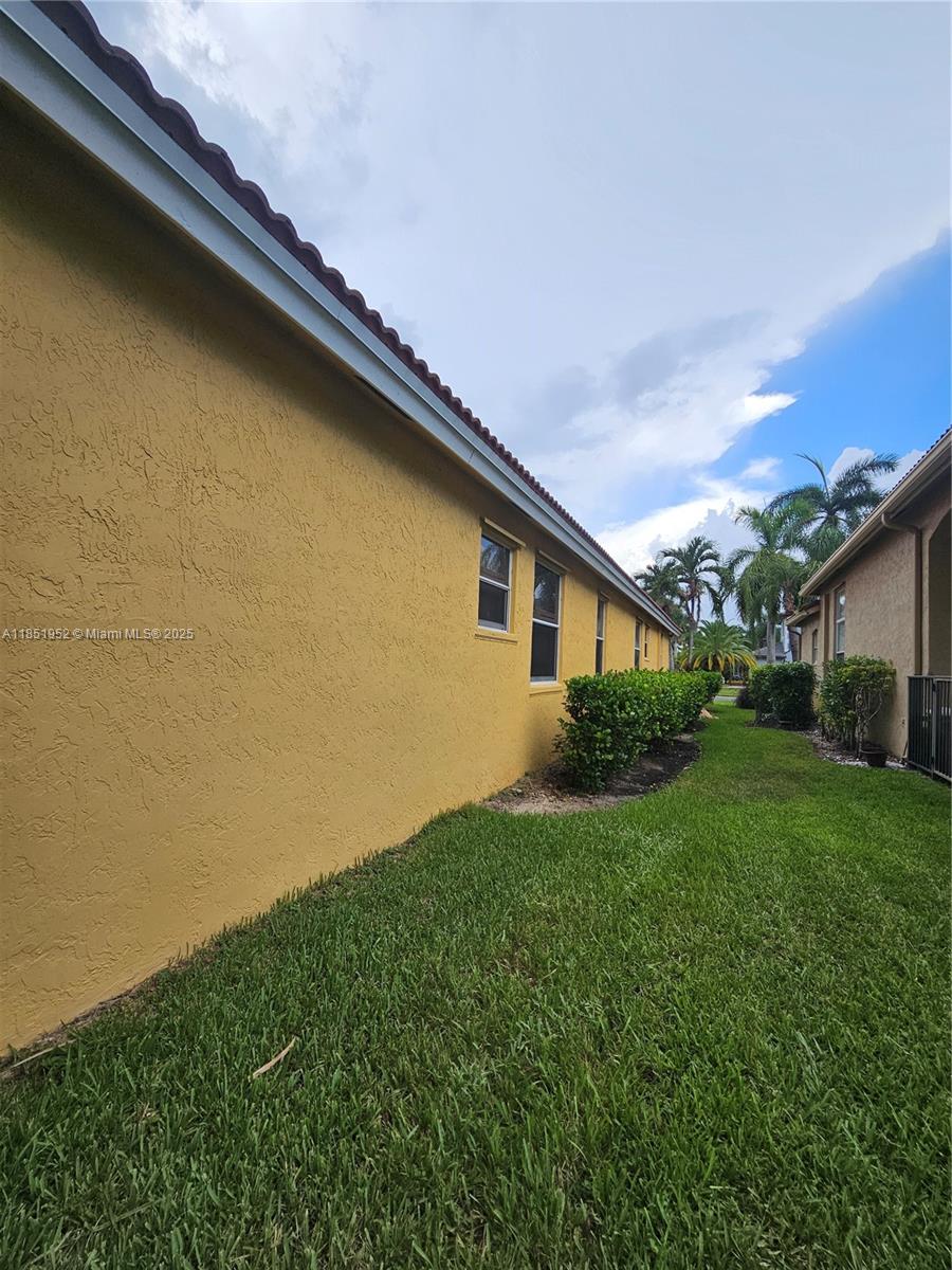 18951 Southwest 30th Street Miramar, FL 33029 - Photo 59 of 62 a view of a backyard with plants and large trees