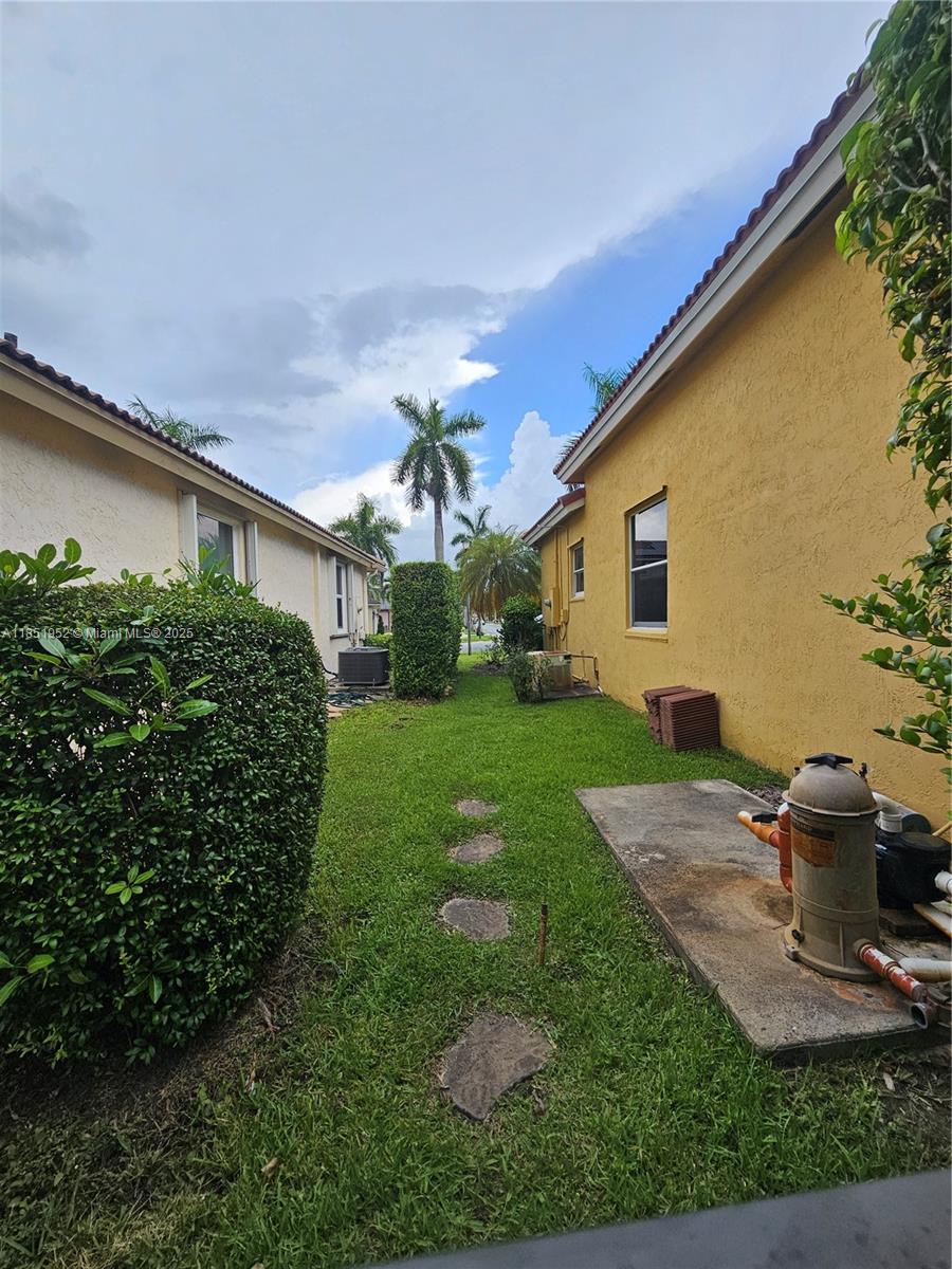 18951 Southwest 30th Street Miramar, FL 33029 - Photo 60 of 62 a front view of a house with garden