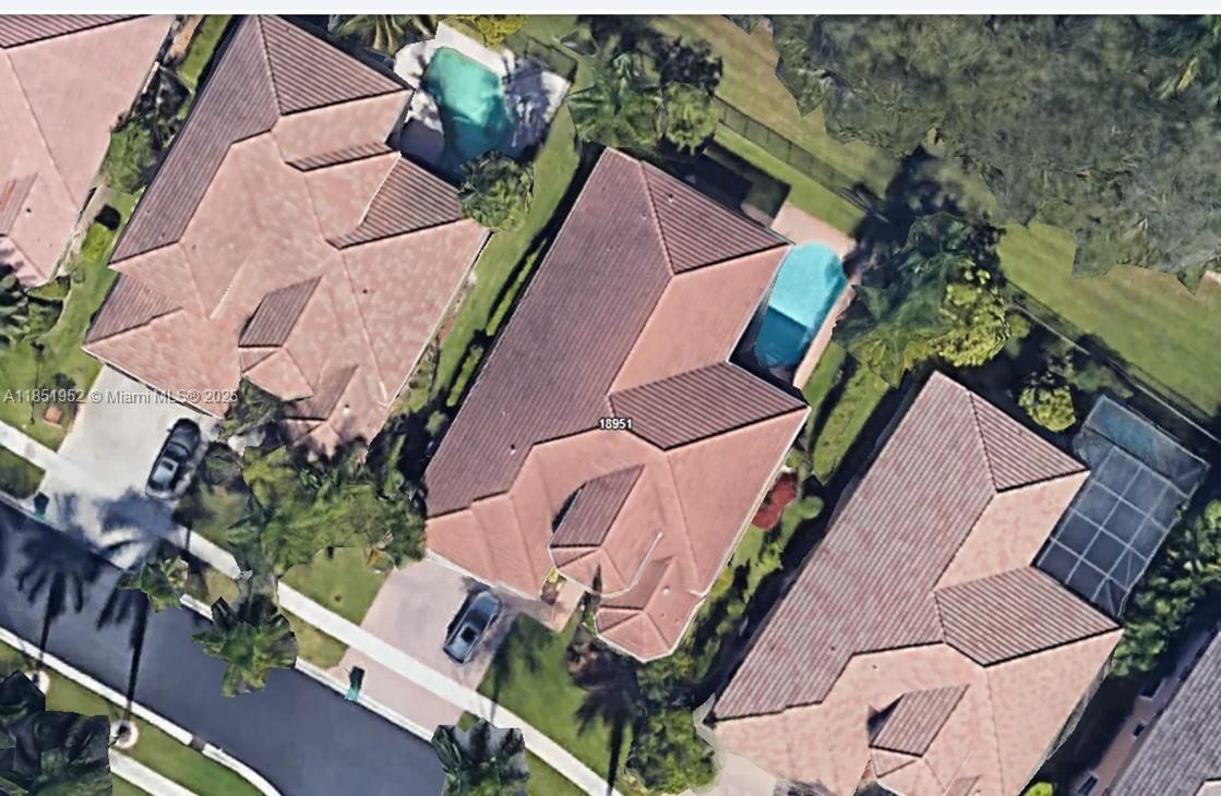 18951 Southwest 30th Street Miramar, FL 33029 - Photo 61 of 62 an aerial view of a house with a yard and tennis court
