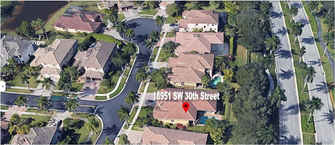 18951 Southwest 30th Street Miramar, FL 33029 - Photo 62 of 62 an aerial view of residential house with an outdoor space and sign board