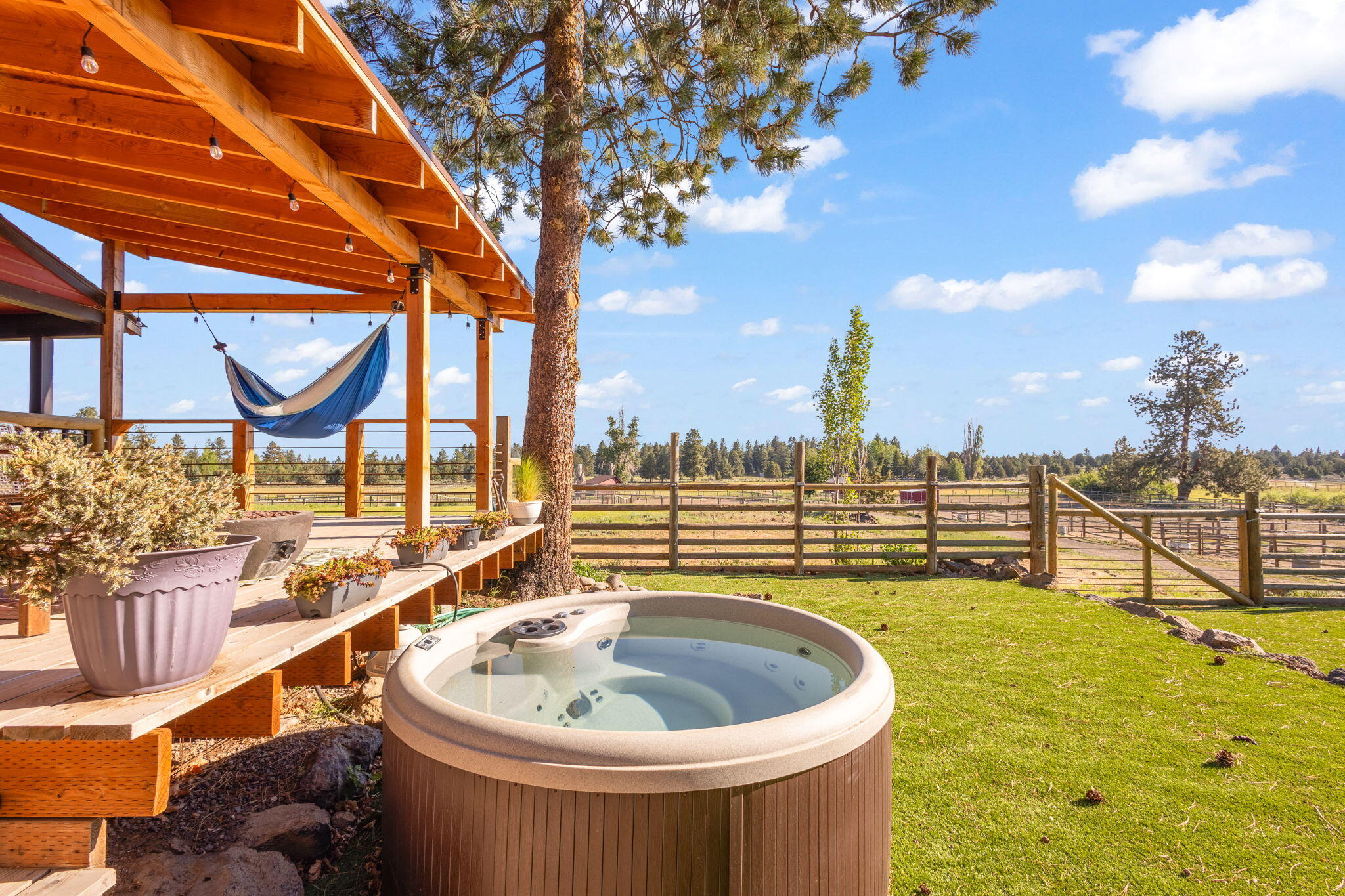60360 Horse Butte Road Bend, OR 97702 - Photo 14 of 58 a view of a swimming pool with a patio and a backyard