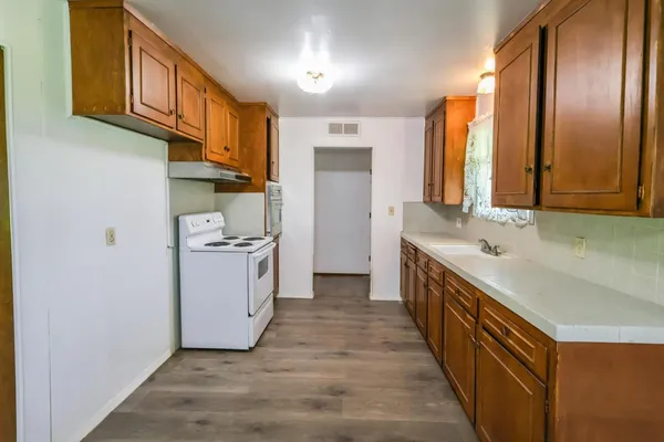 a spacious bathroom with a double vanity sink and a mirror