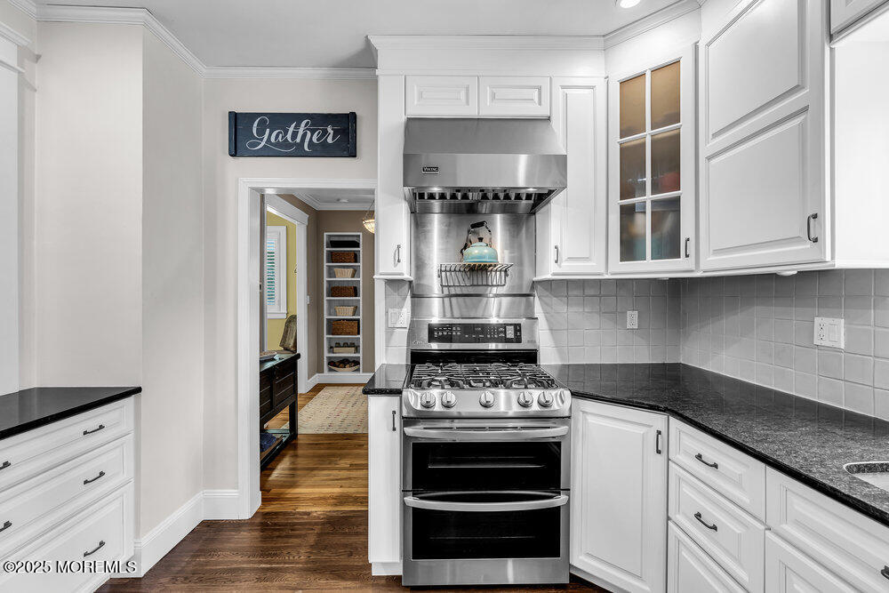 24 Chestnut Street Fair Haven, NJ 07704 - Photo 20 of 42 a kitchen with stainless steel appliances granite countertop white cabinets and a stove