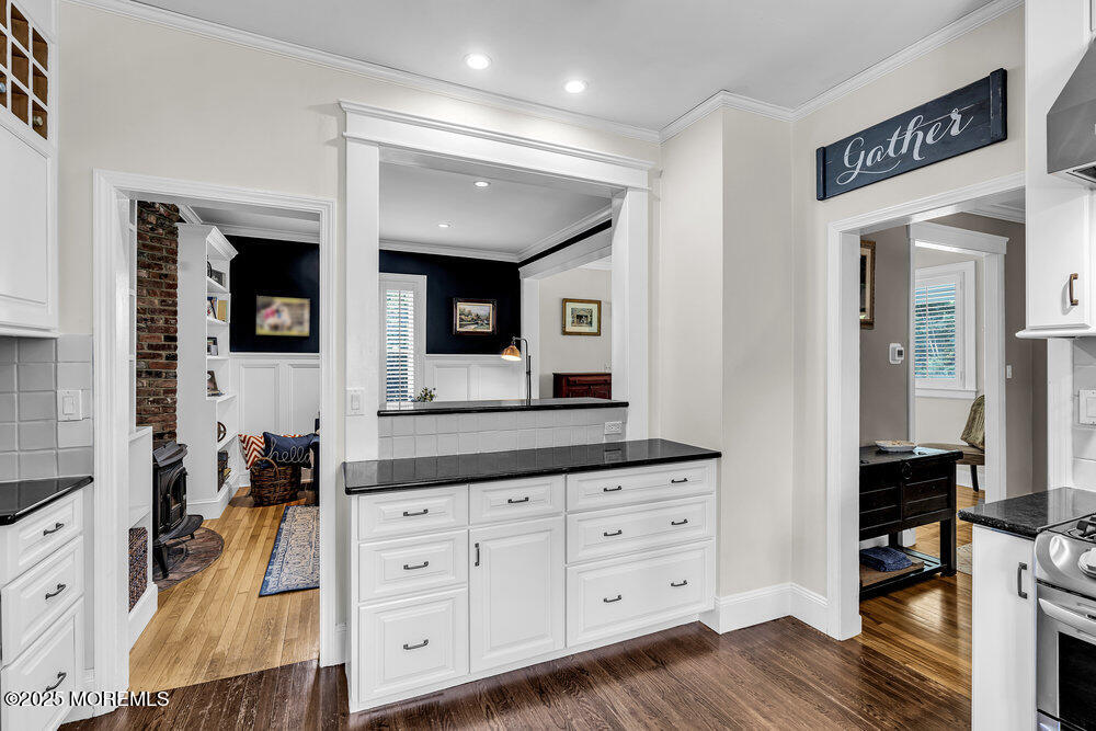 24 Chestnut Street Fair Haven, NJ 07704 - Photo 21 of 42 a spacious bathroom with a granite countertop sink and a mirror