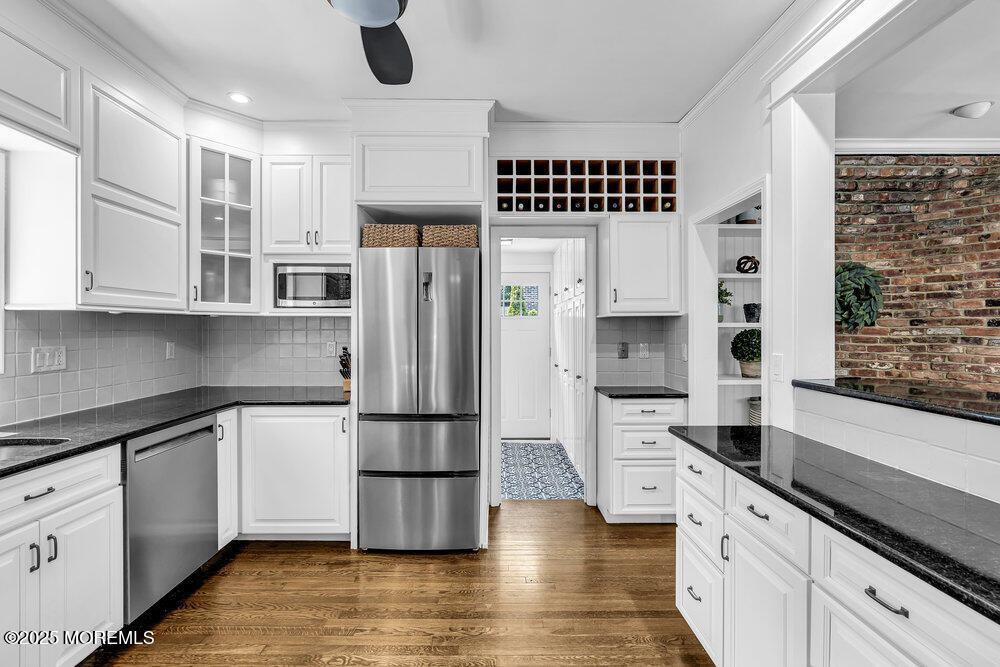 24 Chestnut Street Fair Haven, NJ 07704 - Photo 22 of 42 a kitchen with stainless steel appliances a refrigerator sink and cabinets