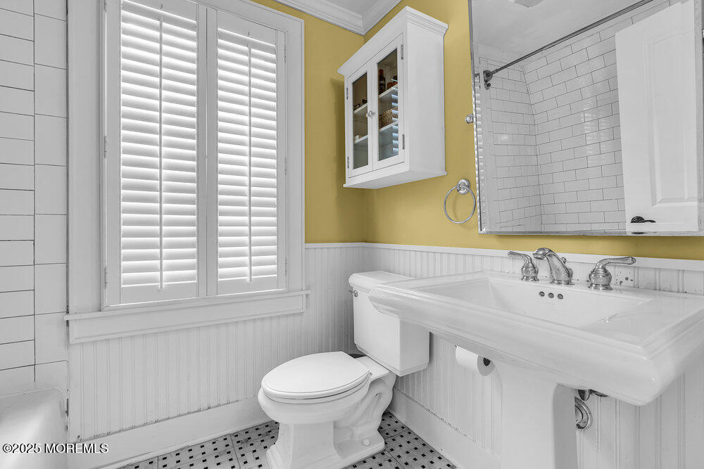 24 Chestnut Street Fair Haven, NJ 07704 - Photo 31 of 42 a bathroom with a sink and a toilet