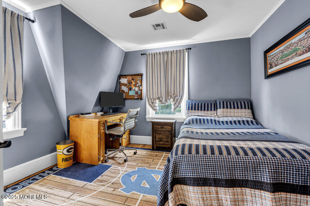 24 Chestnut Street Fair Haven, NJ 07704 - Photo 32 of 42 a bedroom with furniture and a window