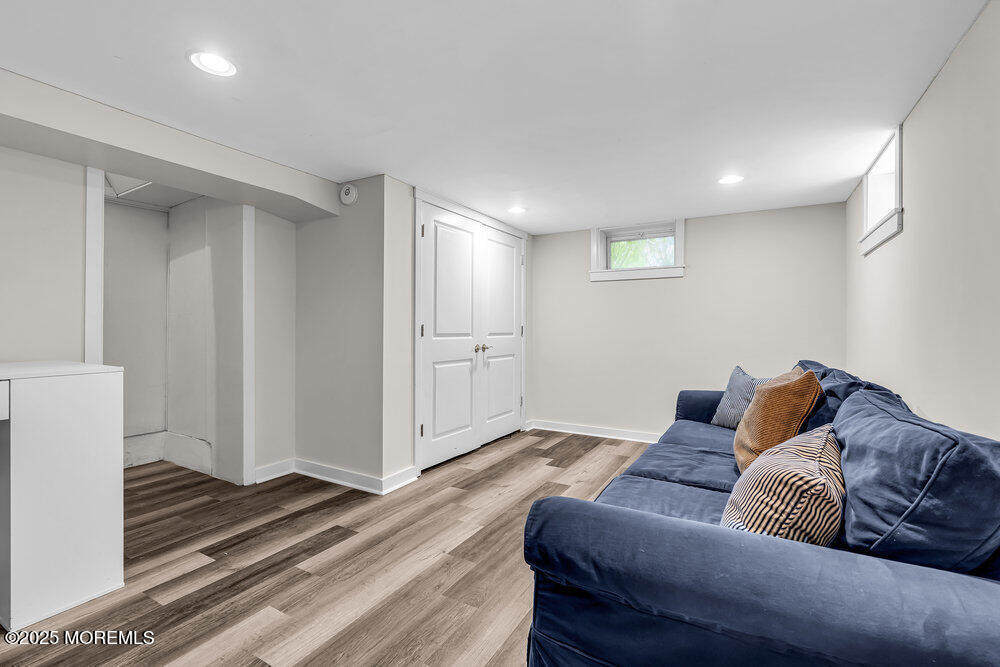 24 Chestnut Street Fair Haven, NJ 07704 - Photo 34 of 42 a living room with furniture and a rug