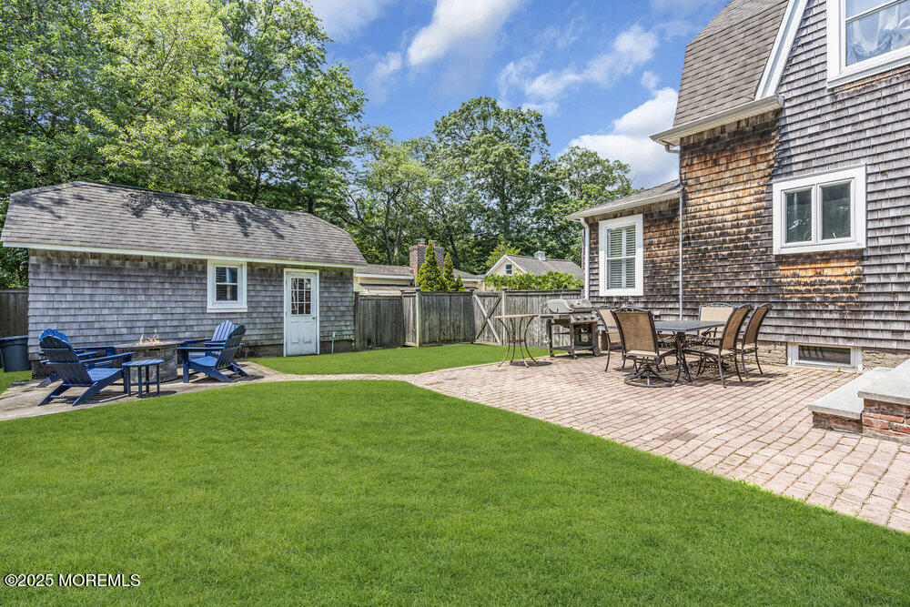 24 Chestnut Street Fair Haven, NJ 07704 - Photo 39 of 42 a view of a house with backyard and sitting area
