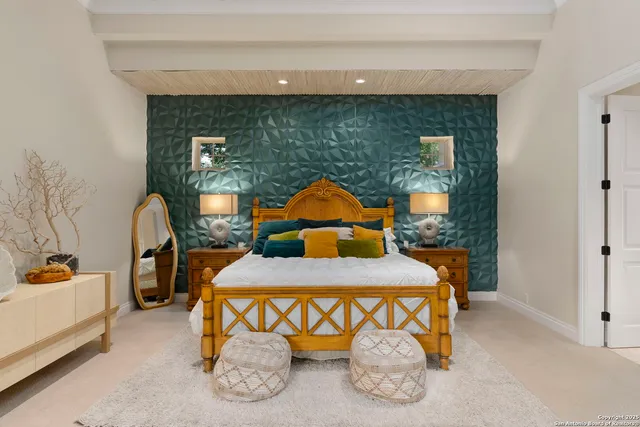 a bedroom with a bed and a couch