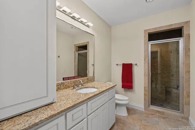 a bedroom with furniture and a window