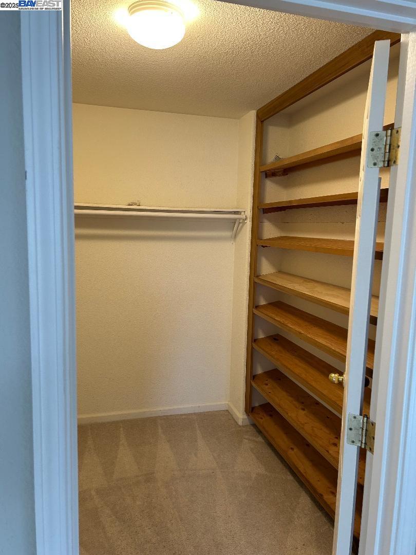 112 Gibson Avenue Bay Point, CA 94565 - Photo 14 of 19 a view of walk in closet with empty racks