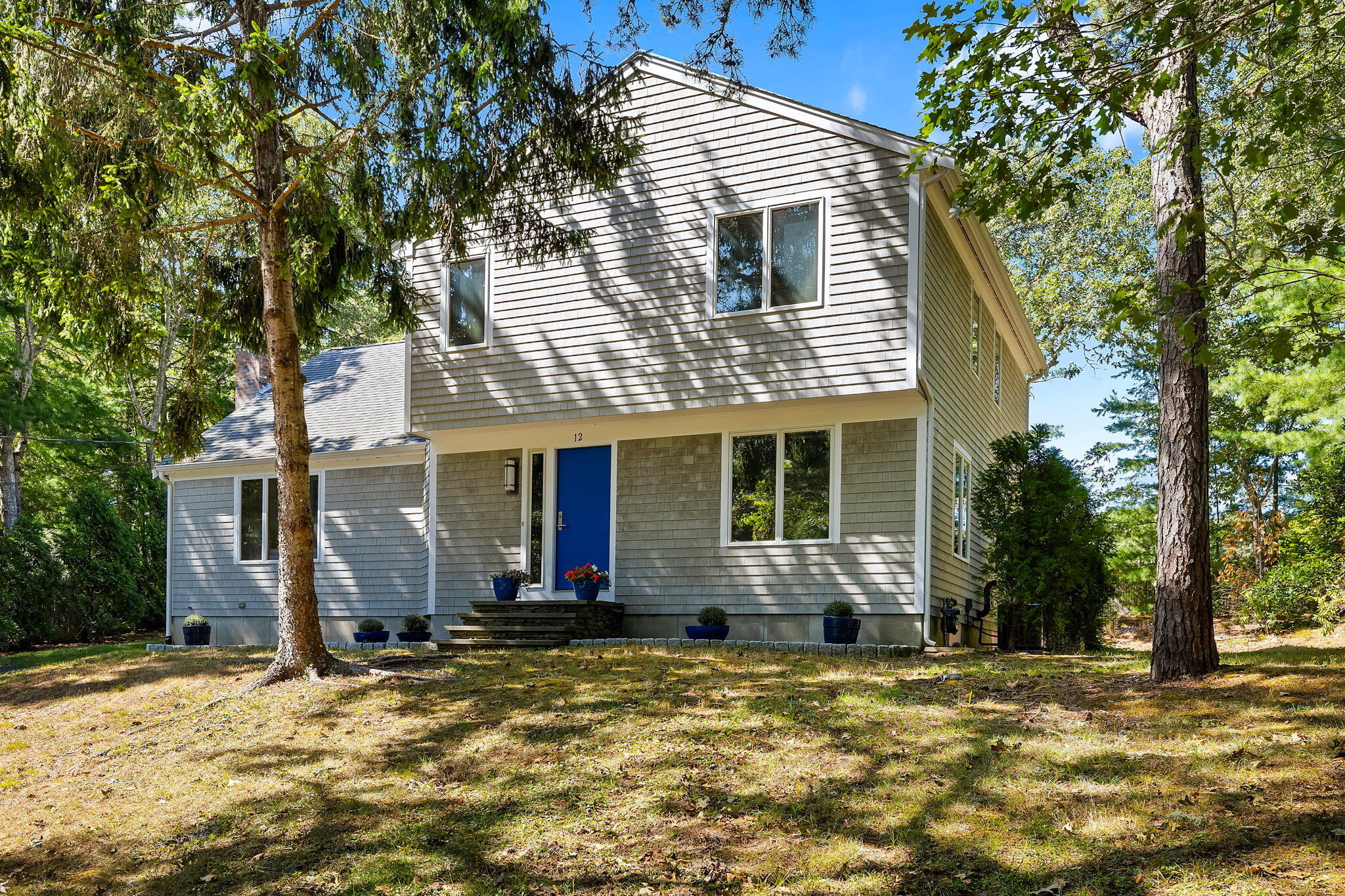 12 Crowell Road Harwich Port, MA 02646 - Photo 3 of 28 a front view of a house with a yard