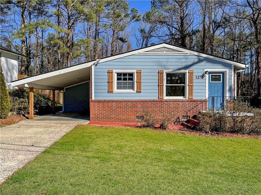 a front view of a house with a yard and porch
