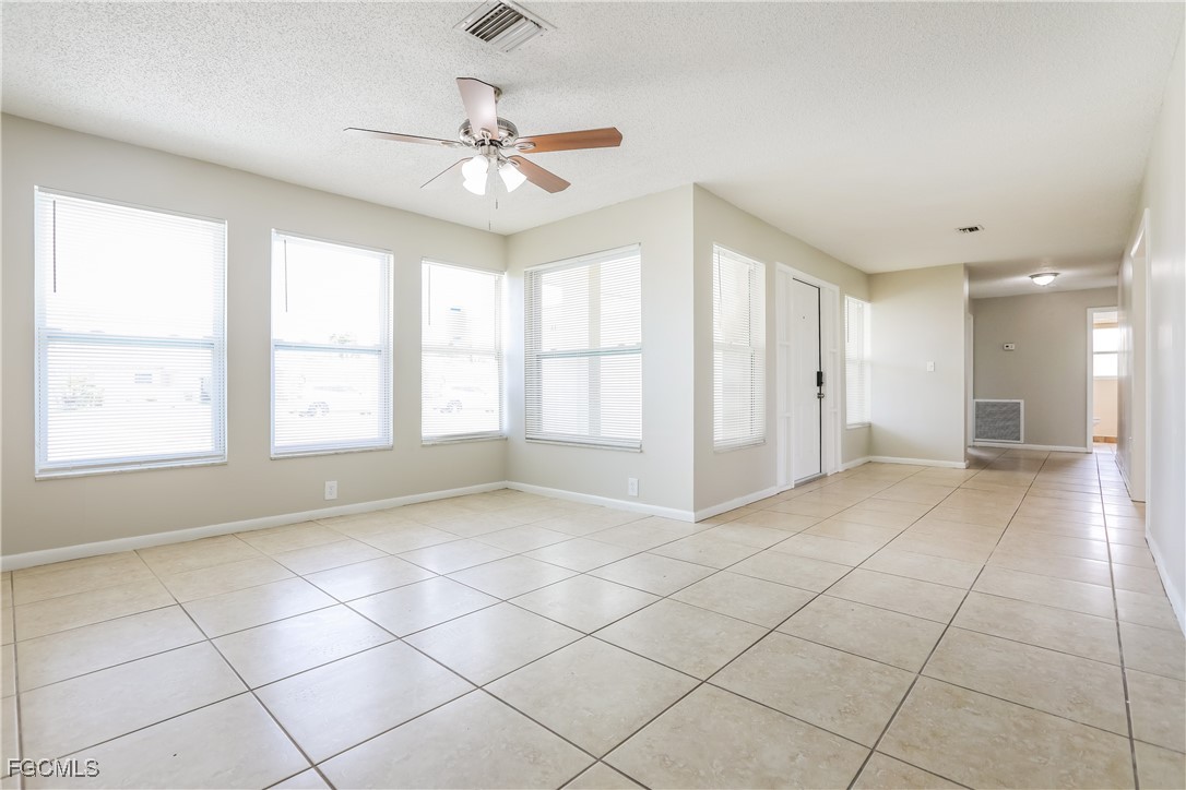 64 Golfview Road Rotonda West, FL 33947 - Photo 5 of 16 a view of an empty room with a window