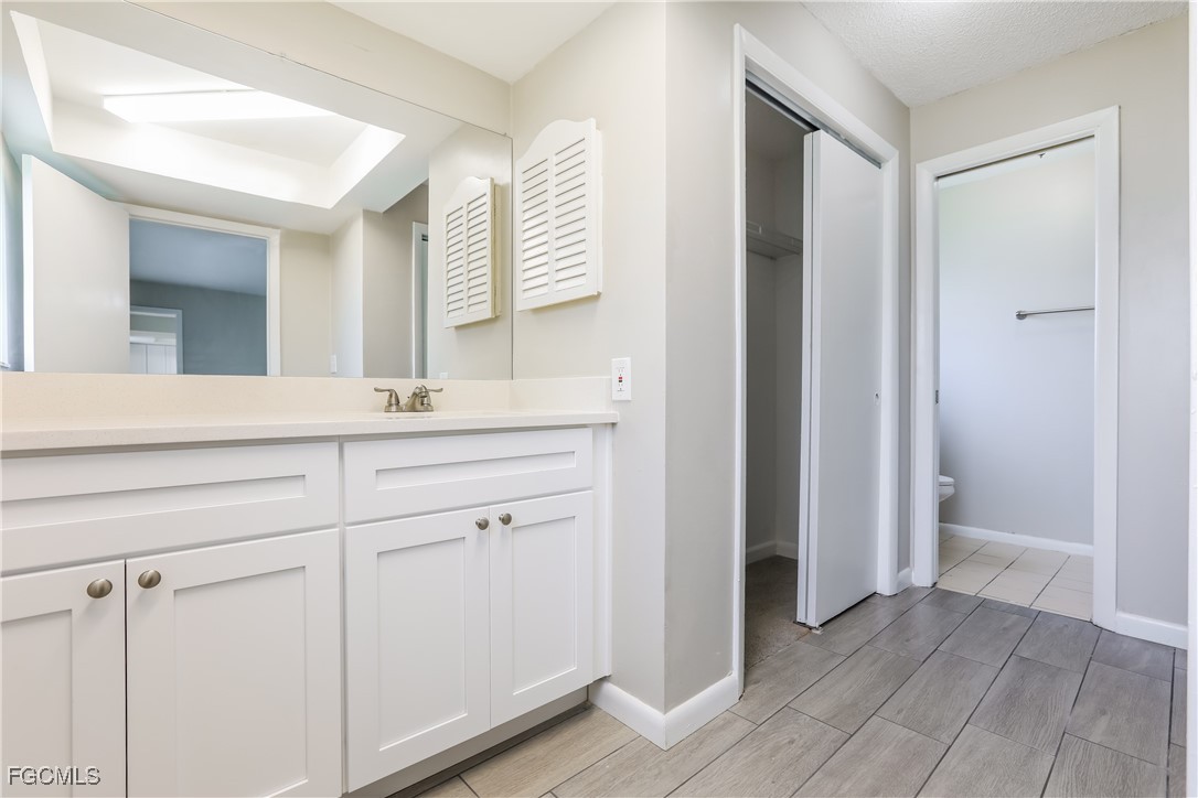 64 Golfview Road Rotonda West, FL 33947 - Photo 10 of 16 a bathroom with a sink and a mirror