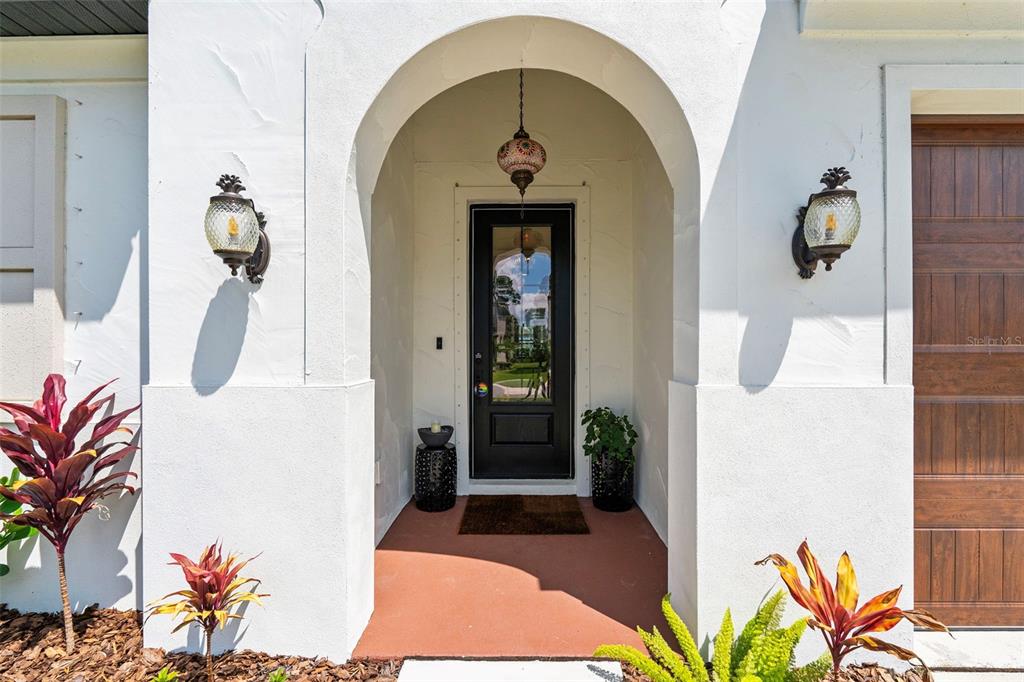 8756 Windlass Cove Palmetto, FL 34221 - Photo 11 of 50 a front view of a house with garden