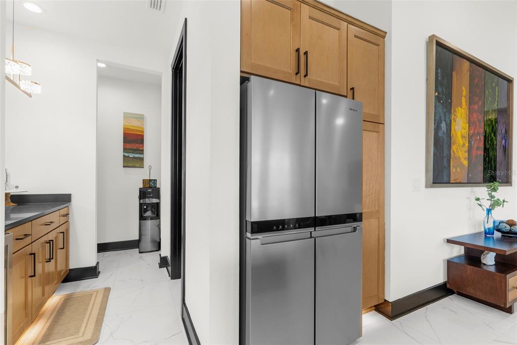 8756 Windlass Cove Palmetto, FL 34221 - Photo 18 of 50 a view of hallway with cabinets