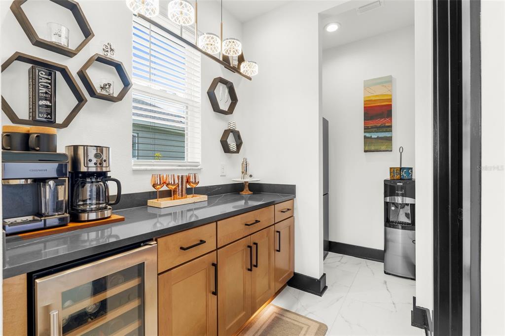 8756 Windlass Cove Palmetto, FL 34221 - Photo 20 of 50 a kitchen with stainless steel appliances granite countertop a stove and a clock on the wall