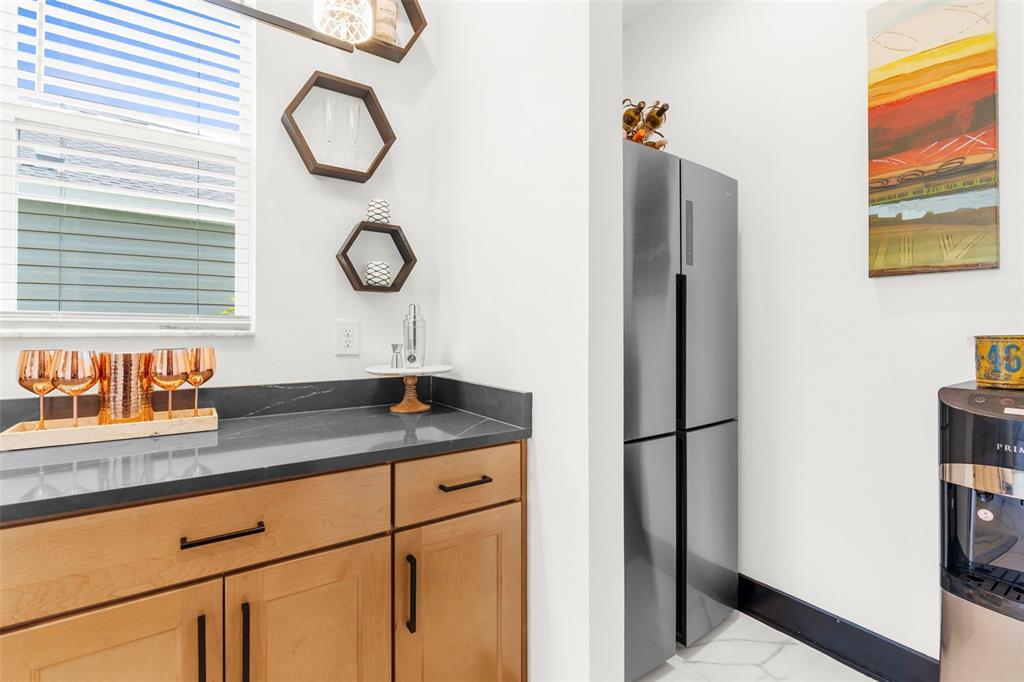 8756 Windlass Cove Palmetto, FL 34221 - Photo 21 of 50 a bathroom with a granite countertop sink and a mirror