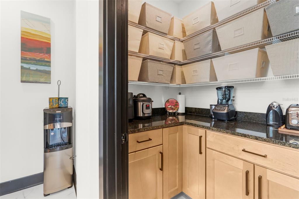 8756 Windlass Cove Palmetto, FL 34221 - Photo 22 of 50 a kitchen with stainless steel appliances granite countertop a sink and cabinets
