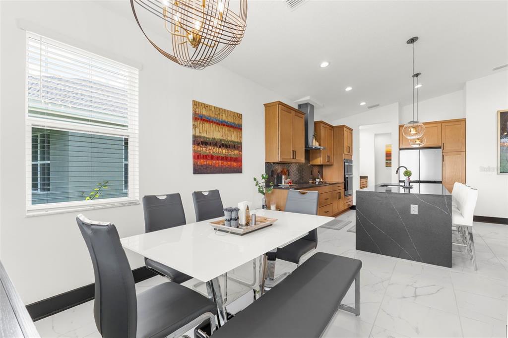 8756 Windlass Cove Palmetto, FL 34221 - Photo 24 of 50 a view of a dining room with furniture window and outside view