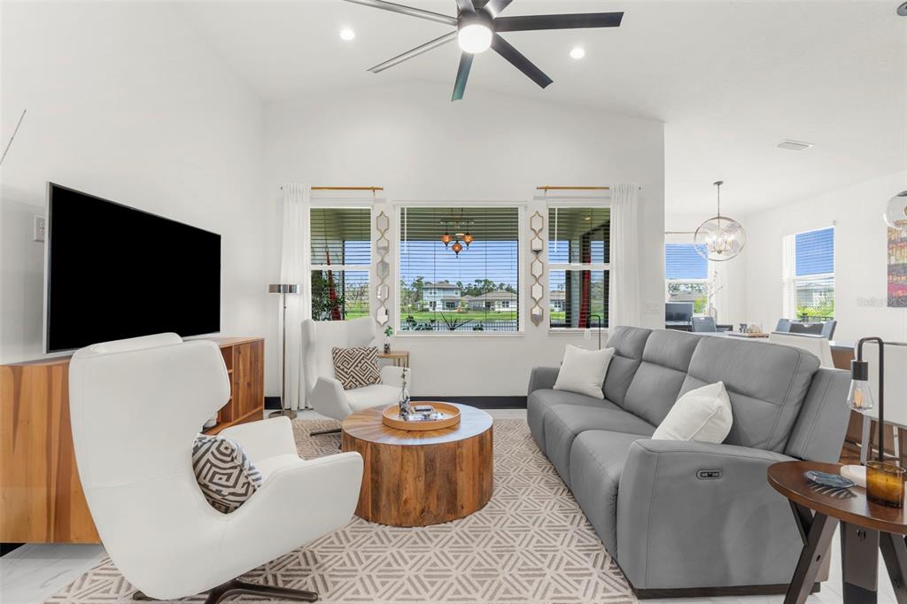 8756 Windlass Cove Palmetto, FL 34221 - Photo 25 of 50 a living room with furniture and a flat screen tv