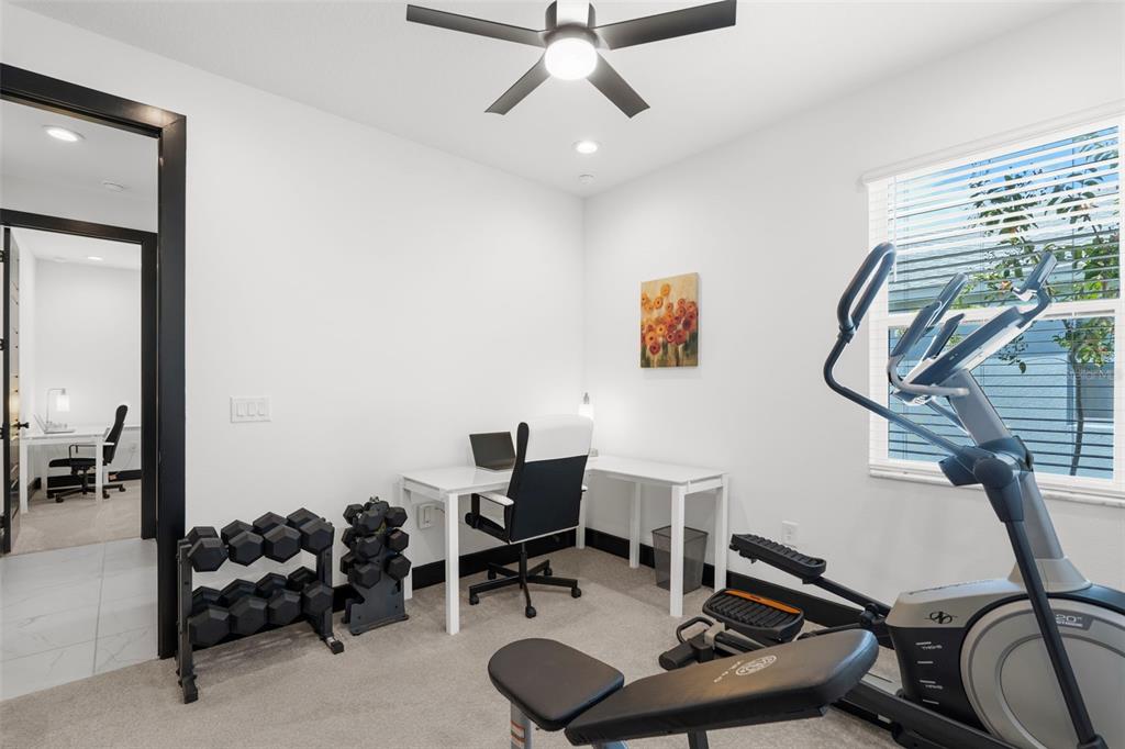 8756 Windlass Cove Palmetto, FL 34221 - Photo 32 of 50 a work room with furniture and gym equipment