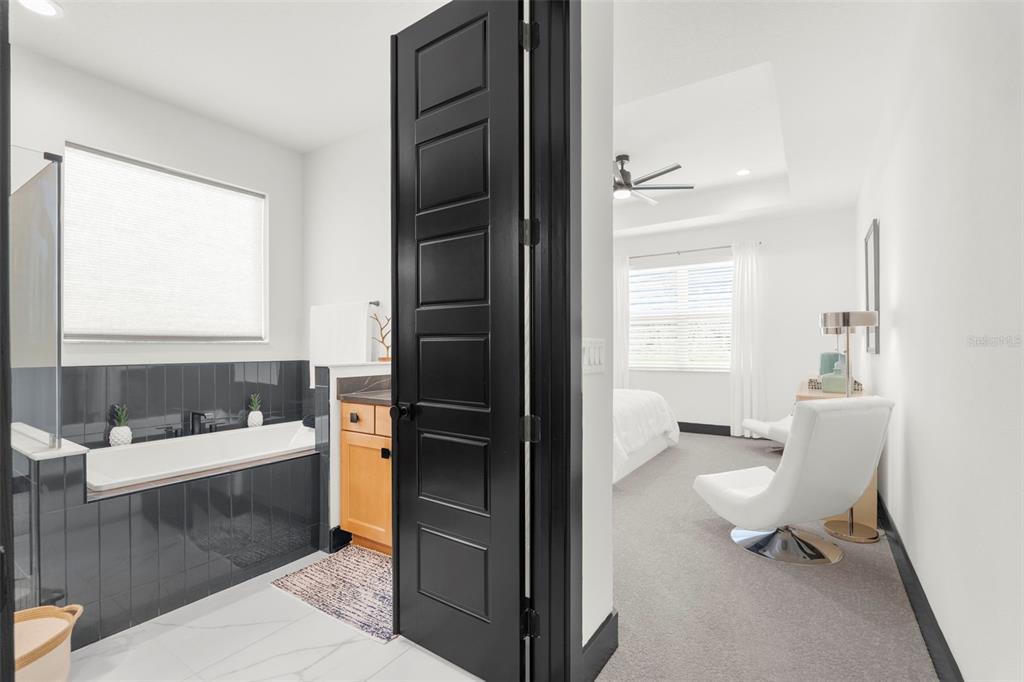 8756 Windlass Cove Palmetto, FL 34221 - Photo 38 of 50 a bathroom with a sink a toilet and a bathtub