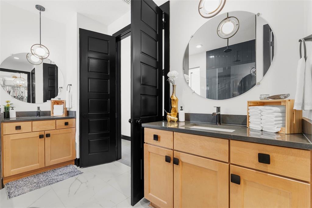 8756 Windlass Cove Palmetto, FL 34221 - Photo 42 of 50 a bathroom with a sink and a mirror