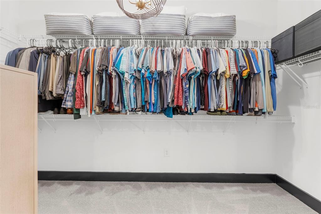 8756 Windlass Cove Palmetto, FL 34221 - Photo 43 of 50 a view of walk in closet with clothes