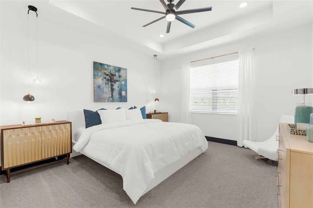 8756 Windlass Cove Palmetto, FL 34221 - Photo 46 of 50 a bedroom with a bed and a window