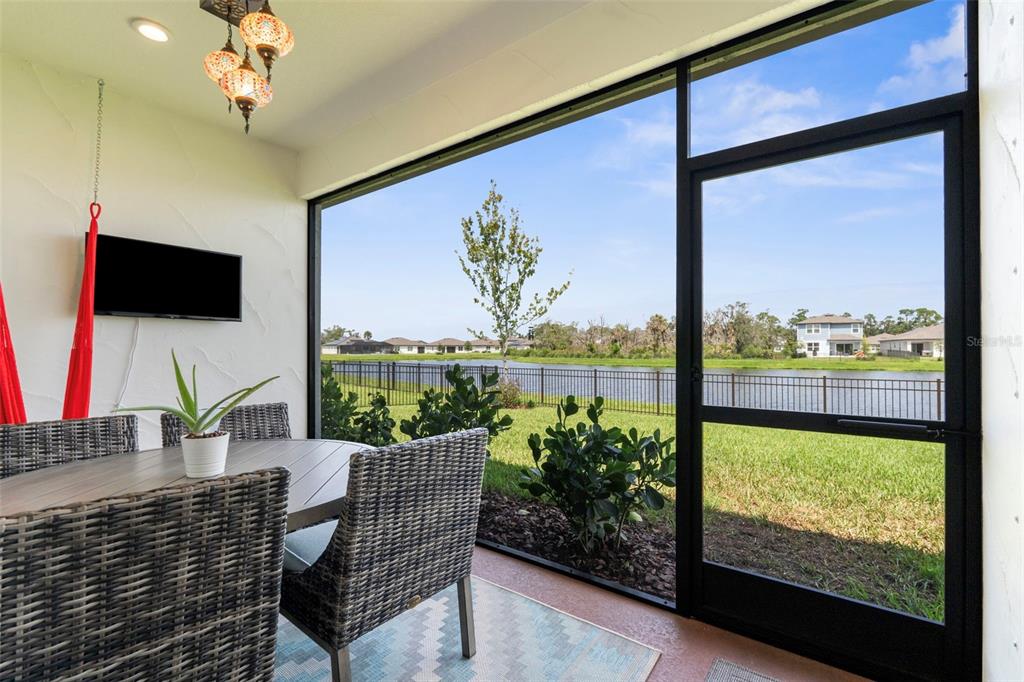 8756 Windlass Cove Palmetto, FL 34221 - Photo 47 of 50 a view of a dining room with furniture window and outside view