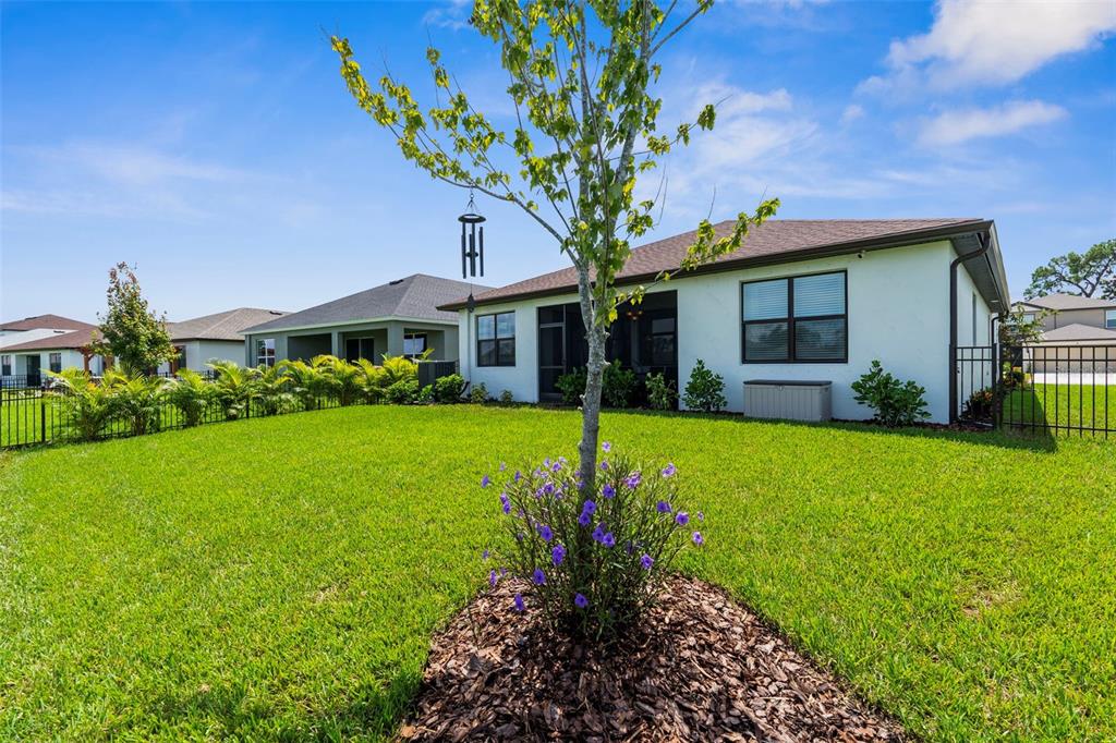 8756 Windlass Cove Palmetto, FL 34221 - Photo 9 of 50 a front view of a house with garden
